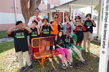 Commissioner-Cherasard-Coral-Cove-students-and-their-Principal-celebrate-the-installation-of-Buddy-Benches-at-Coral-Cove-Academy