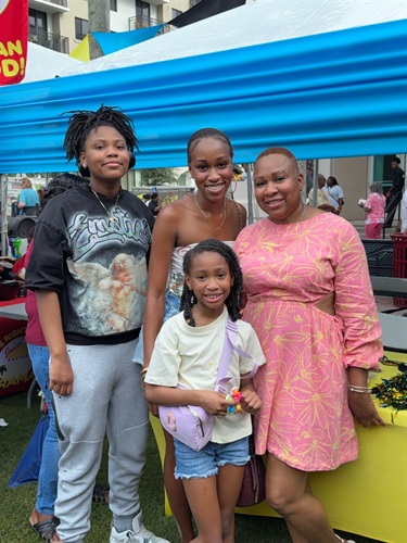 Smiling-family-enjoying-culture-and-community-at-Bahamas-Goombay-Broward