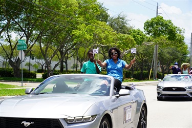 Commissioner Cherasard at the Miramar Day Motorcade driving along Miramar Parkway