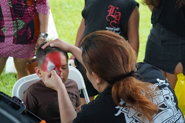 Child-getting-face-painted-at-Play-It-Safe-Palooza