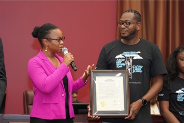 Commissioner-Cherasard-speaking-at-Commission-Meeting-for-Foster-Youth-Voice-Month