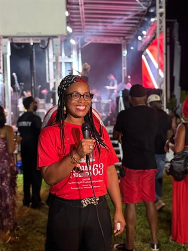 Commissioner Cherasard with mic at the Trinidad and Tobago Independence Celebration