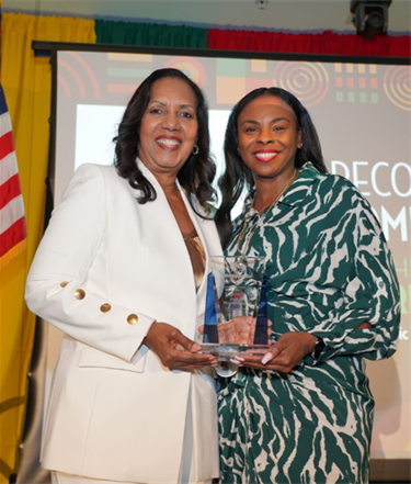 Commissioner Colbourne presents Juneteenth award to Dachelle Myrick-Campbell